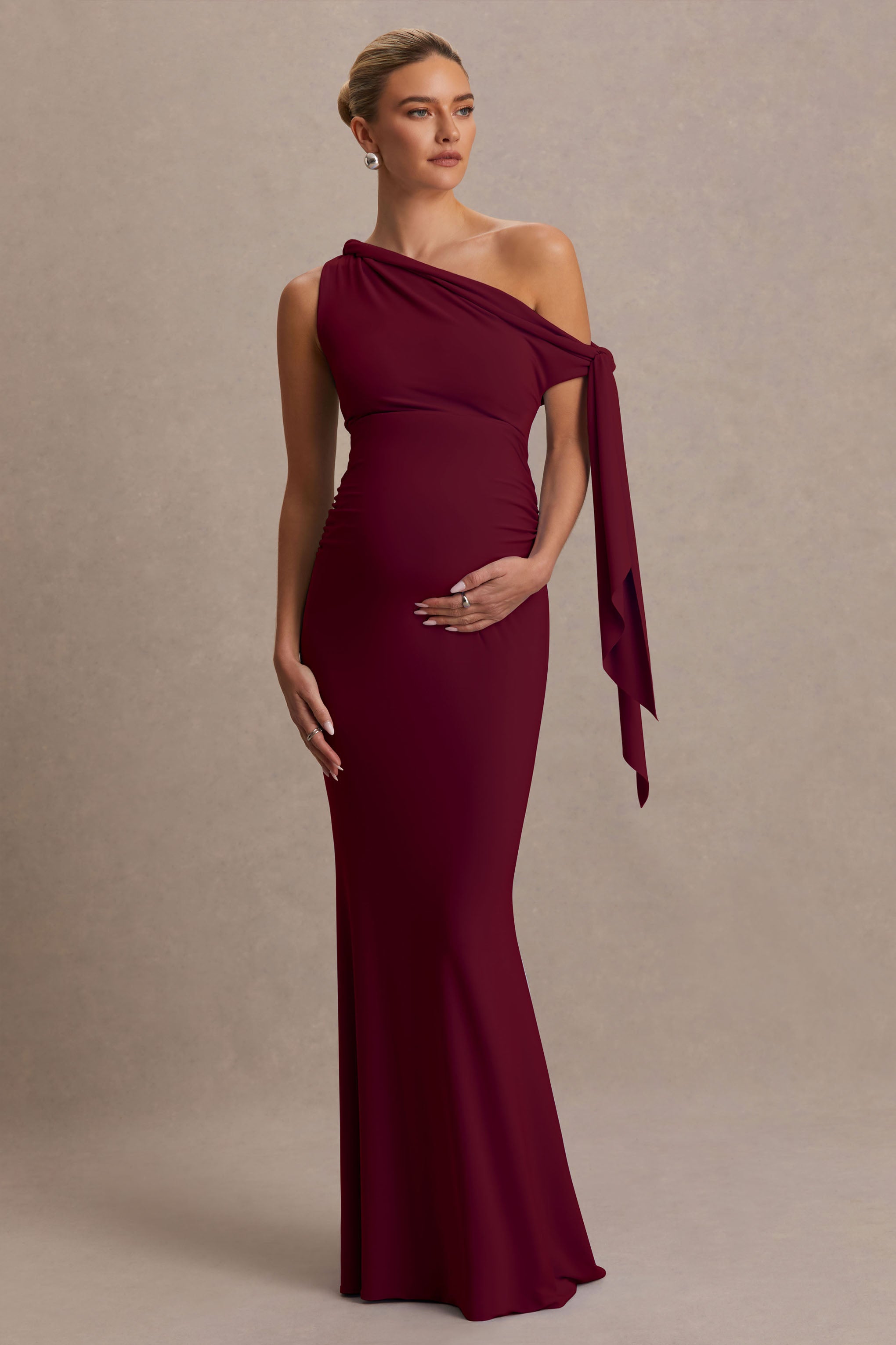 Orielle Burgundy Asymmetric-Neck Maternity Maxi Dress With Knot-Sleeve And Sash – front view
