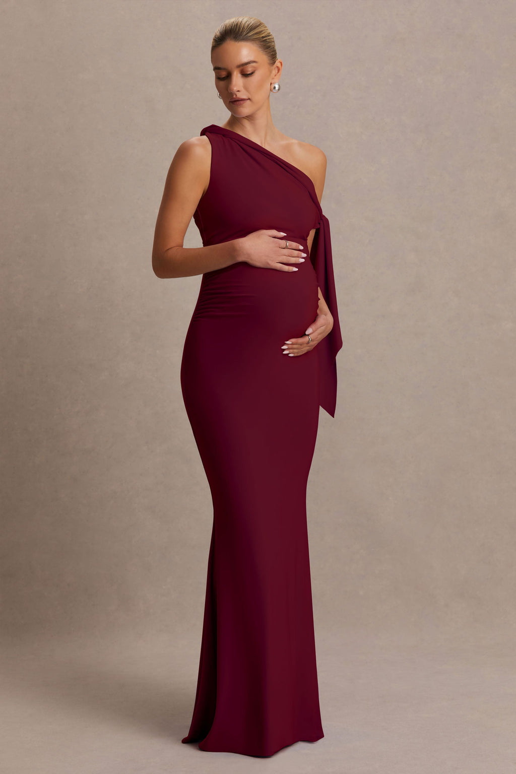 Orielle Burgundy Asymmetric-Neck Maternity Maxi Dress With Knot-Sleeve And Sash – side view