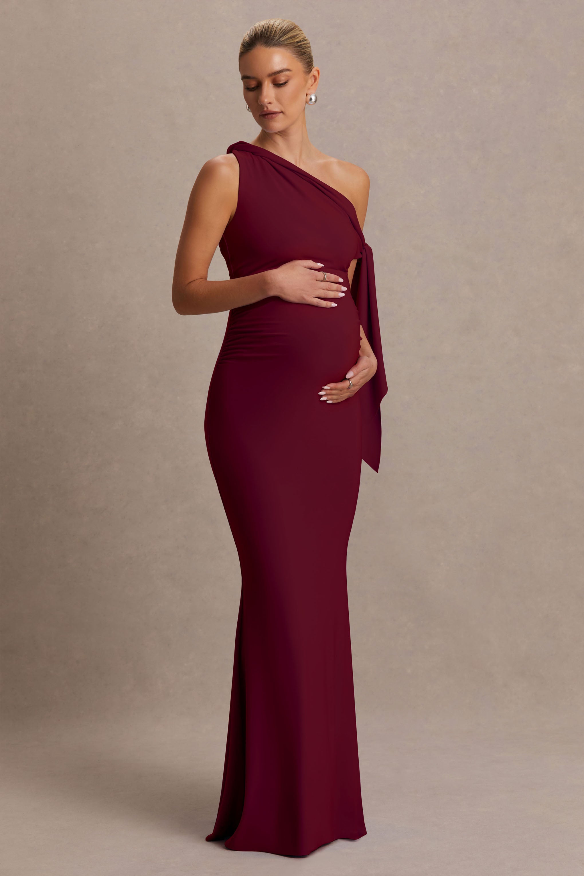 Orielle Burgundy Asymmetric-Neck Maternity Maxi Dress With Knot-Sleeve And Sash – side view