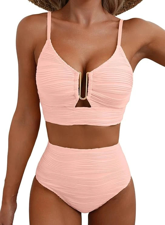 Woman wearing a baby pink high-waisted elegant bikini set - lifestyle photo