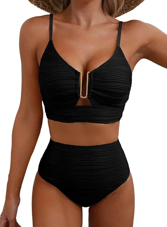 Woman wearing a black high-waisted elegant bikini set - studio photo