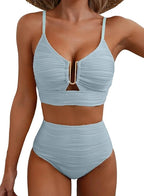 Woman wearing a light blue high-waisted elegant bikini set - lifestyle photo