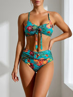 Driftly blue deep V-neck halter bikini set with high-waisted bottoms, in a minimalist studio setting with soft window light.