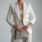 Woman wearing a white double-breasted long sleeve blazer - editorial style photo