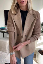 Woman wearing a brown knit double-breasted blazer - mirror selfie style photo