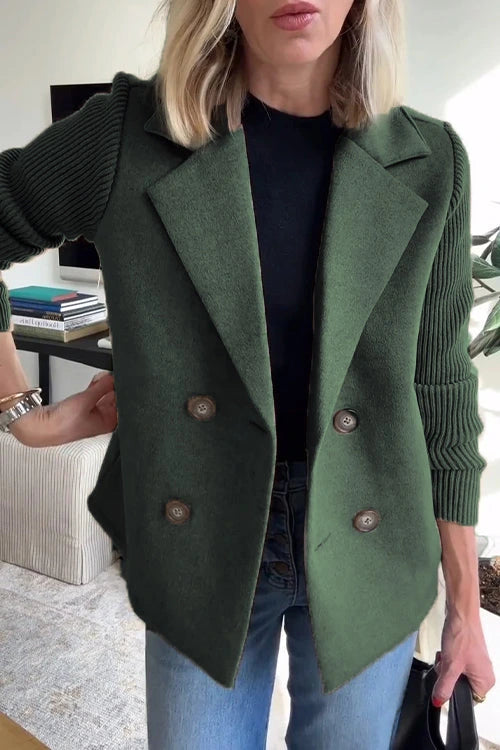 Woman wearing a green knit double-breasted blazer - studio photo