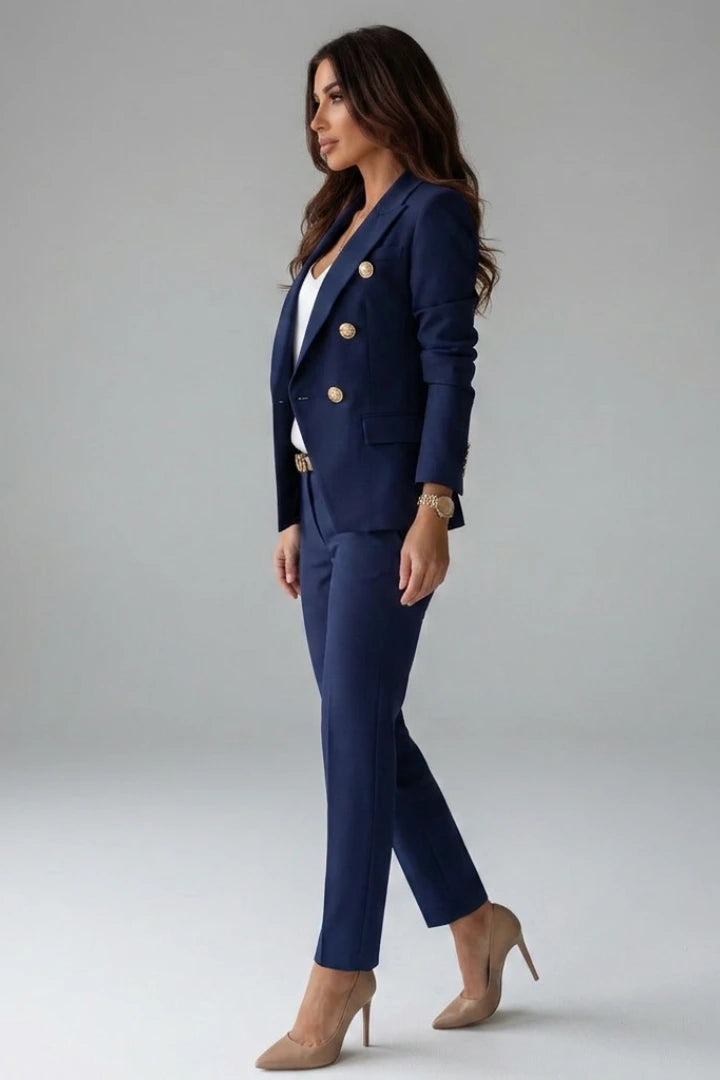 Woman wearing a navy blue double-breasted button office blazer set - studio photo