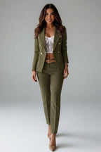 Woman wearing a olive green double-breasted button office blazer set - studio photo