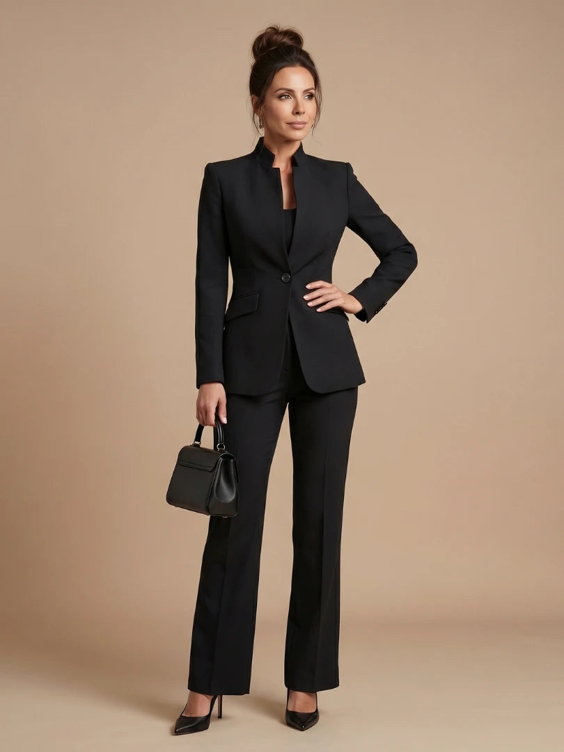 Woman wearing a black structured stand collar tailored blazer - studio photo