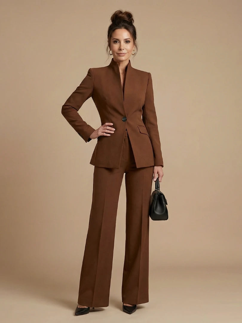 Woman wearing a brown structured stand collar tailored blazer - studio photo