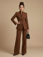Woman wearing a brown structured stand collar tailored blazer - studio photo