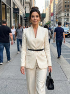 Woman wearing a white structured stand collar tailored blazer - lifestyle photo