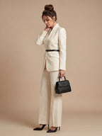 Woman wearing a white structured stand collar tailored blazer - studio photo