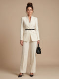Woman wearing a white structured stand collar tailored blazer - studio photo