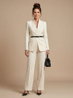Woman wearing a white structured stand collar tailored blazer - studio photo
