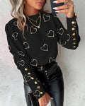 Black long sleeve blouse with metallic heart print, front view