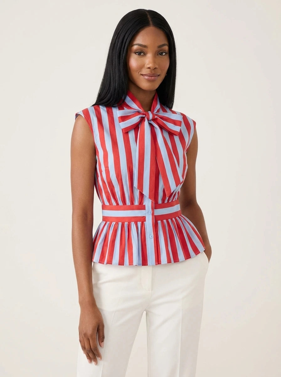 Red and light blue striped sleeveless blouse with bowknot tie neck and peplum waist, studio front view.
