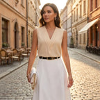 Driftly women's beige sleeveless soft-touch blouse, styled with a white midi skirt on a European street at golden hour.