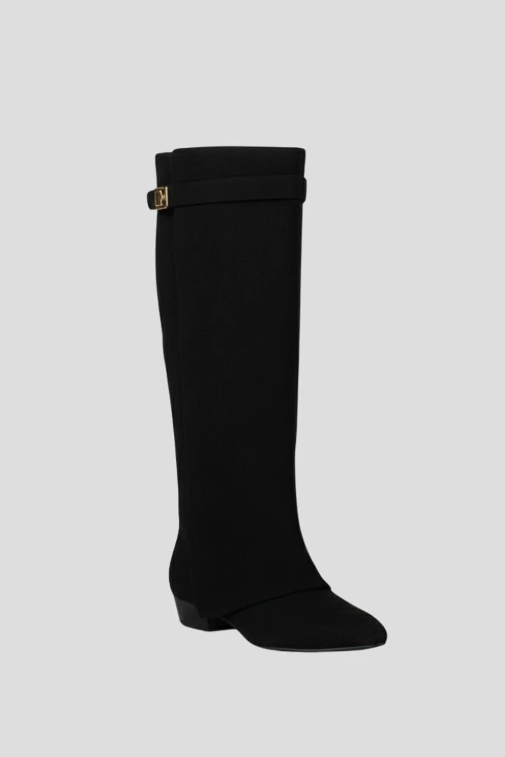 Woman wearing a black suede wide opening block heel boot - studio photo