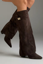Woman wearing a brown suede wide opening block heel boot - studio photo
