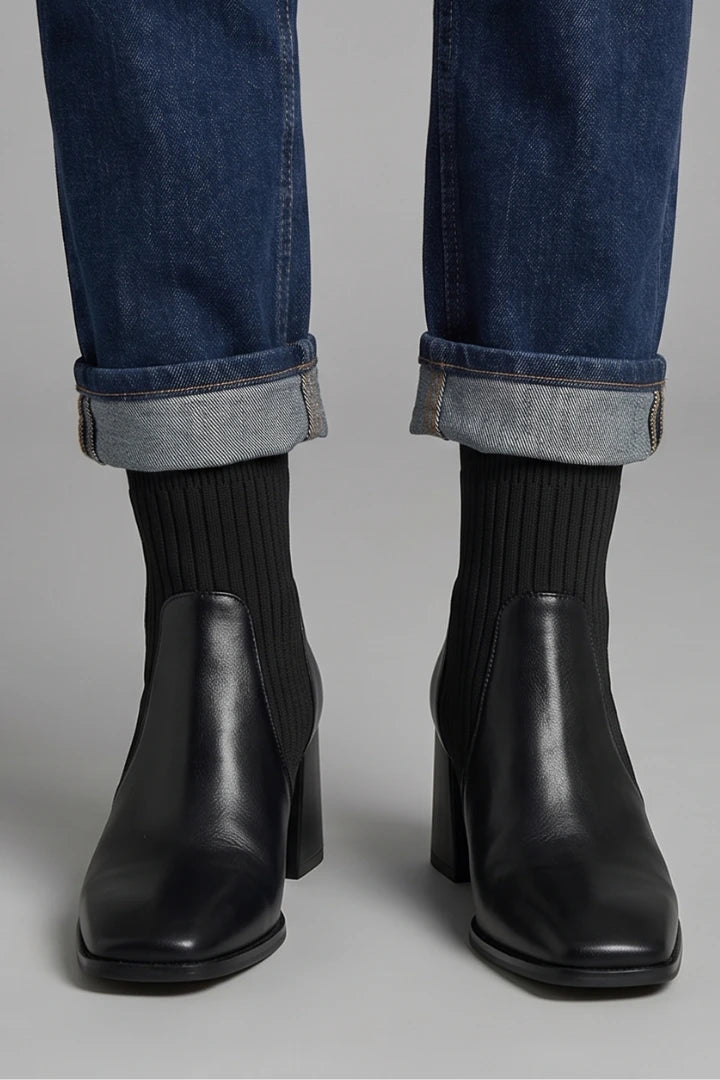 Woman wearing brown block heel ankle boots - lifestyle photo