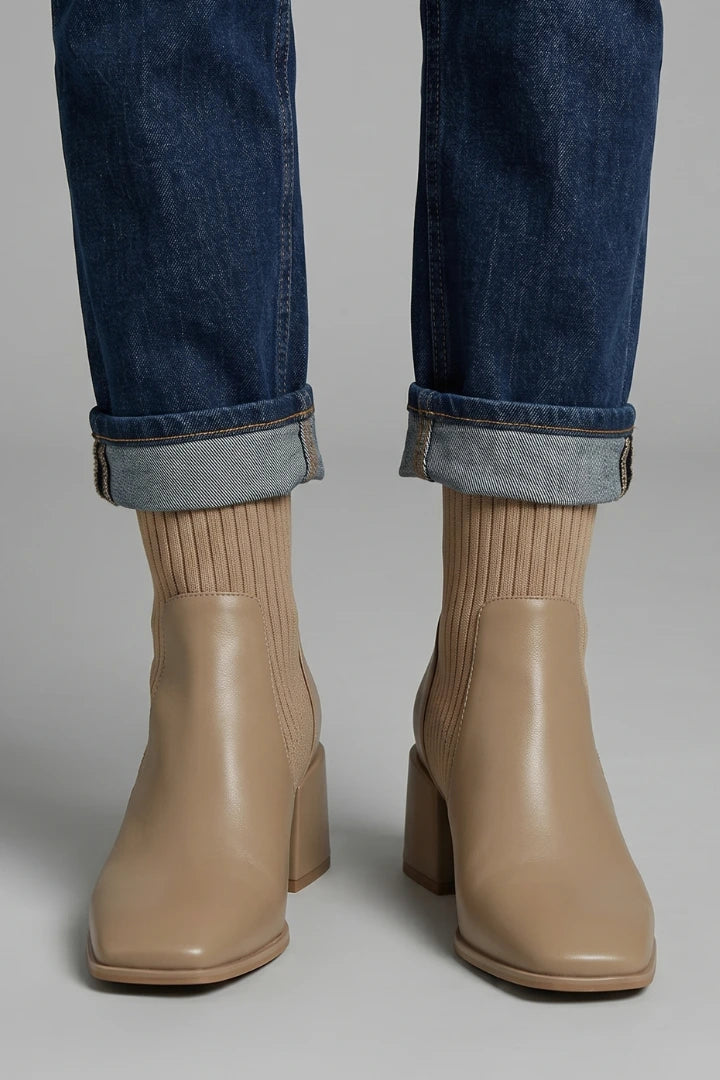 Woman wearing khaki block heel ankle boots - lifestyle photo