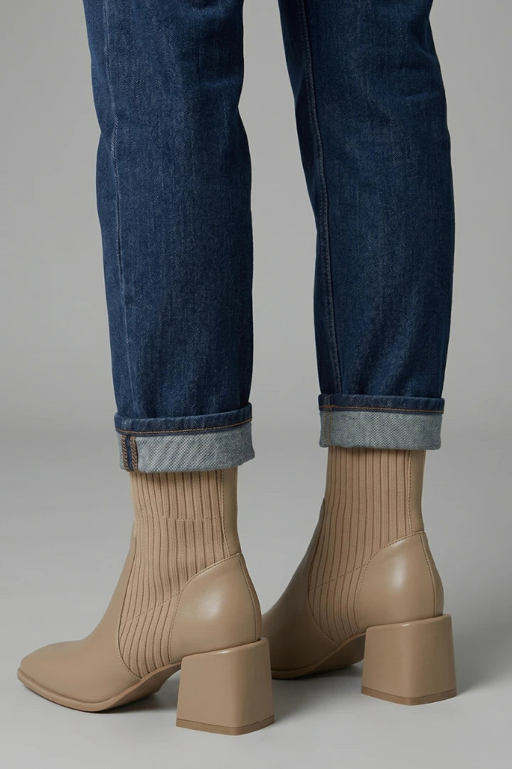 Woman wearing khaki block heel ankle boots - lifestyle photo