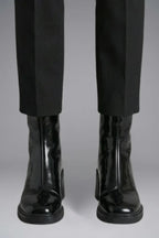 Woman wearing black block heel side zipper ankle boots - lifestyle photo