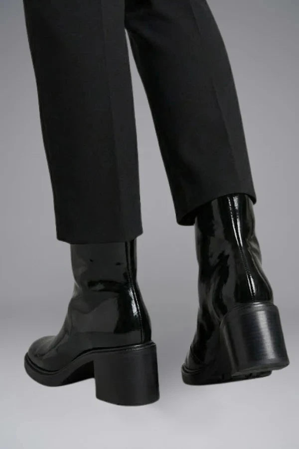 Woman wearing black block heel side zipper ankle boots - lifestyle photo