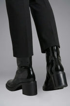 Woman wearing black block heel side zipper ankle boots - lifestyle photo