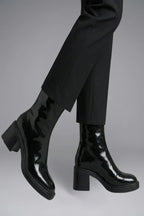 Woman wearing black block heel side zipper ankle boots - lifestyle photo