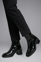 Woman wearing black block heel side zipper ankle boots - lifestyle photo