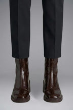 Woman wearing brown block heel side zipper ankle boots - lifestyle photo