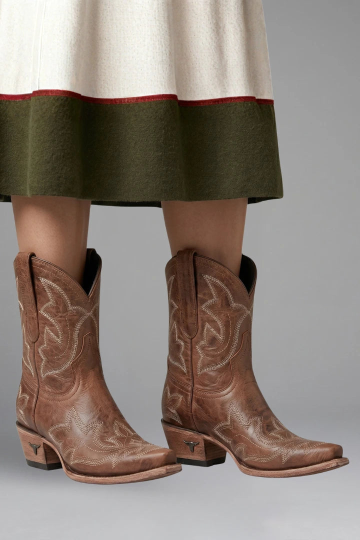 Woman wearing brown embroidered detailing all-season boots - lifestyle photo