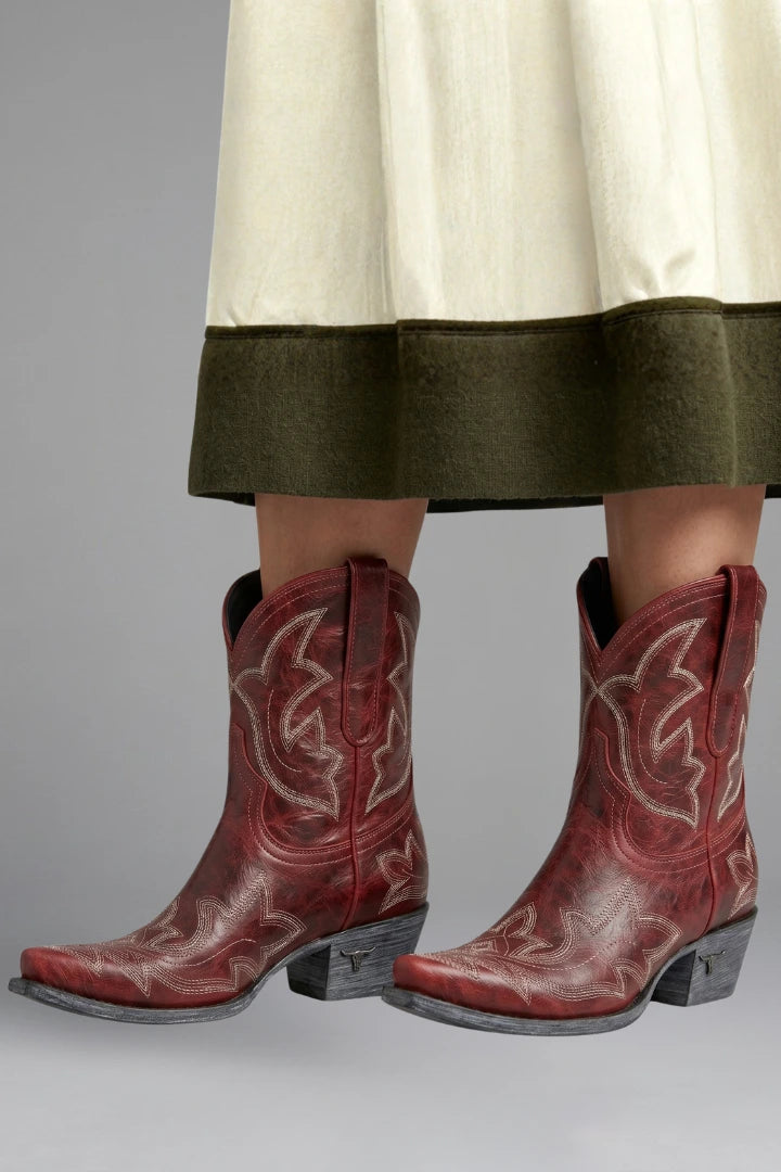Woman wearing brown embroidered detailing all-season boots - lifestyle photo