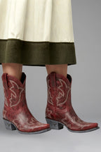 Woman wearing red embroidered detailing all-season boots - lifestyle photo