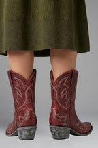 Woman wearing red embroidered detailing all-season boots - lifestyle photo