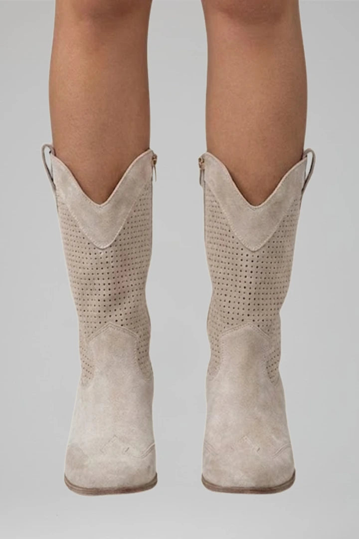 Woman wearing beige low block heel fall boots - lifestyle photo