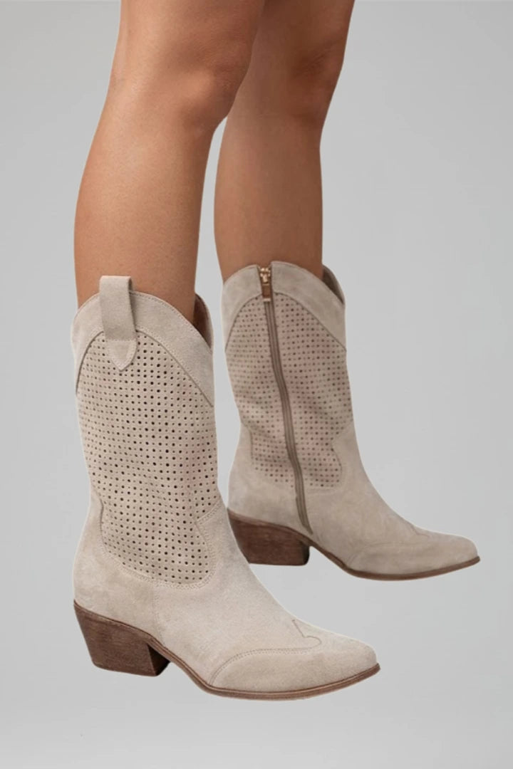 Woman wearing beige low block heel fall boots - lifestyle photo