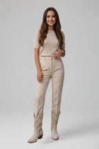Woman wearing beige low block heel fall boots - lifestyle photo
