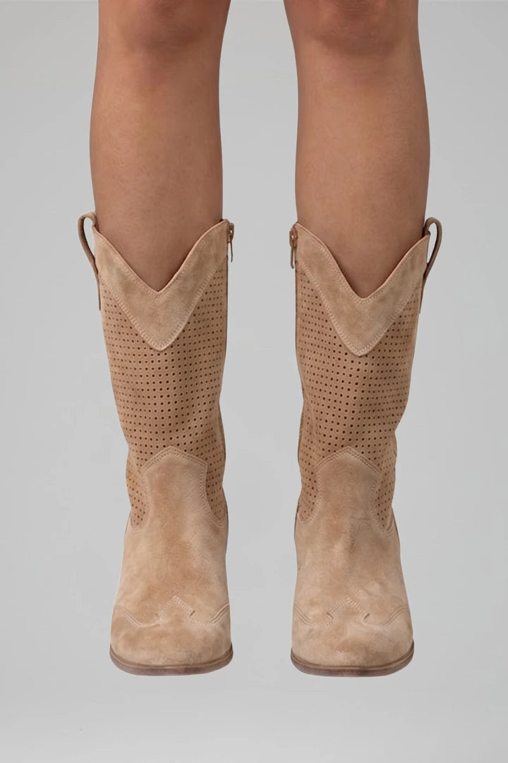 Woman wearing brown low block heel fall boots - lifestyle photo