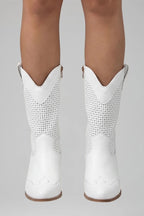 Woman wearing white low block heel fall boots - studio photo