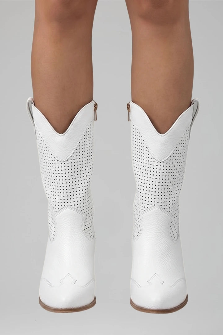 Woman wearing white low block heel fall boots - studio photo