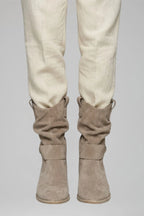Woman wearing beige mid-calf side zipper boots - lifestyle photo