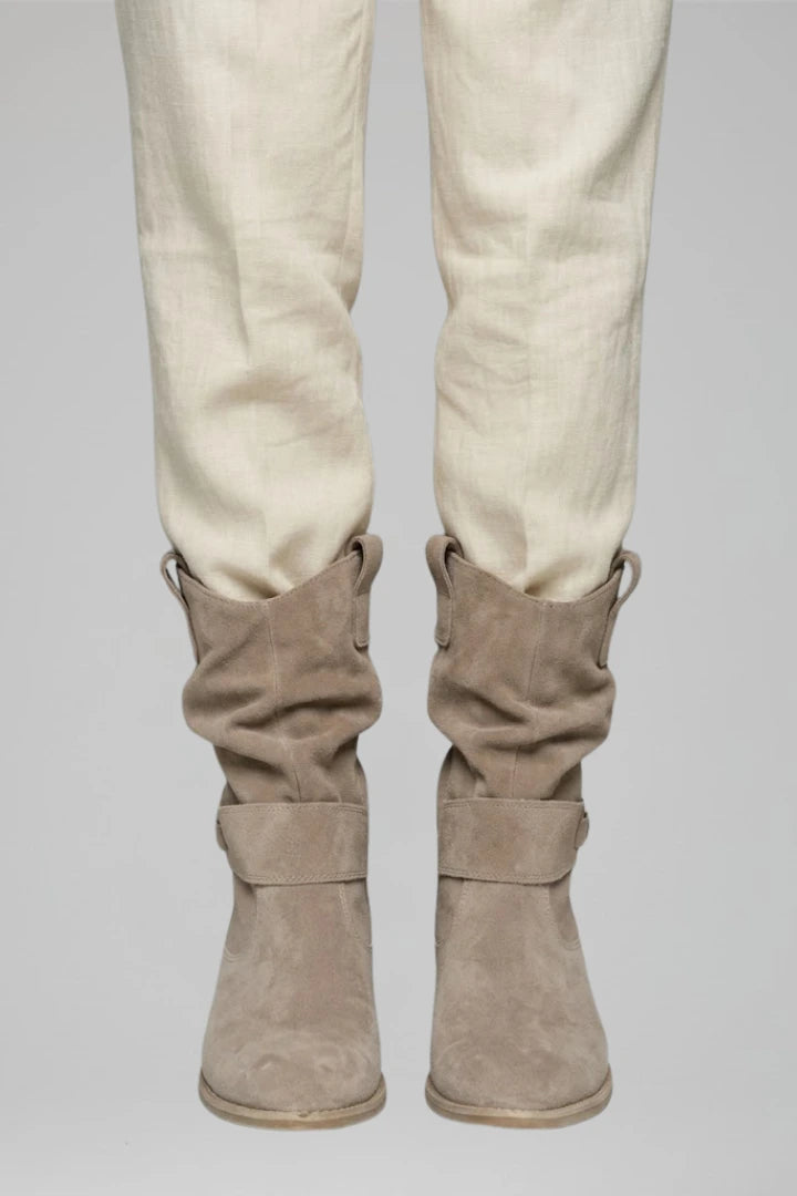 Woman wearing beige mid-calf side zipper boots - lifestyle photo