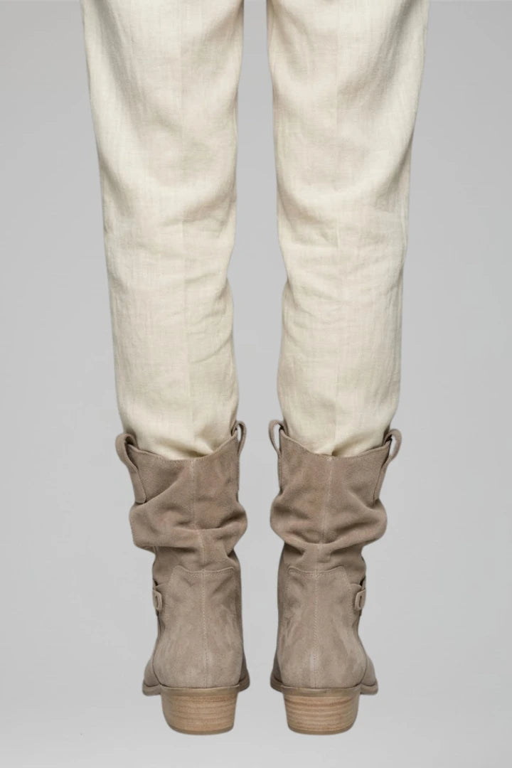 Woman wearing beige mid-calf side zipper boots - lifestyle photo