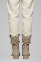 Woman wearing beige mid-calf side zipper boots - lifestyle photo