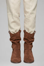 Woman wearing dark brown mid-calf side zipper boots - lifestyle photo
