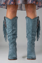 Woman wearing blue orthopedic block heel boots - studio photo