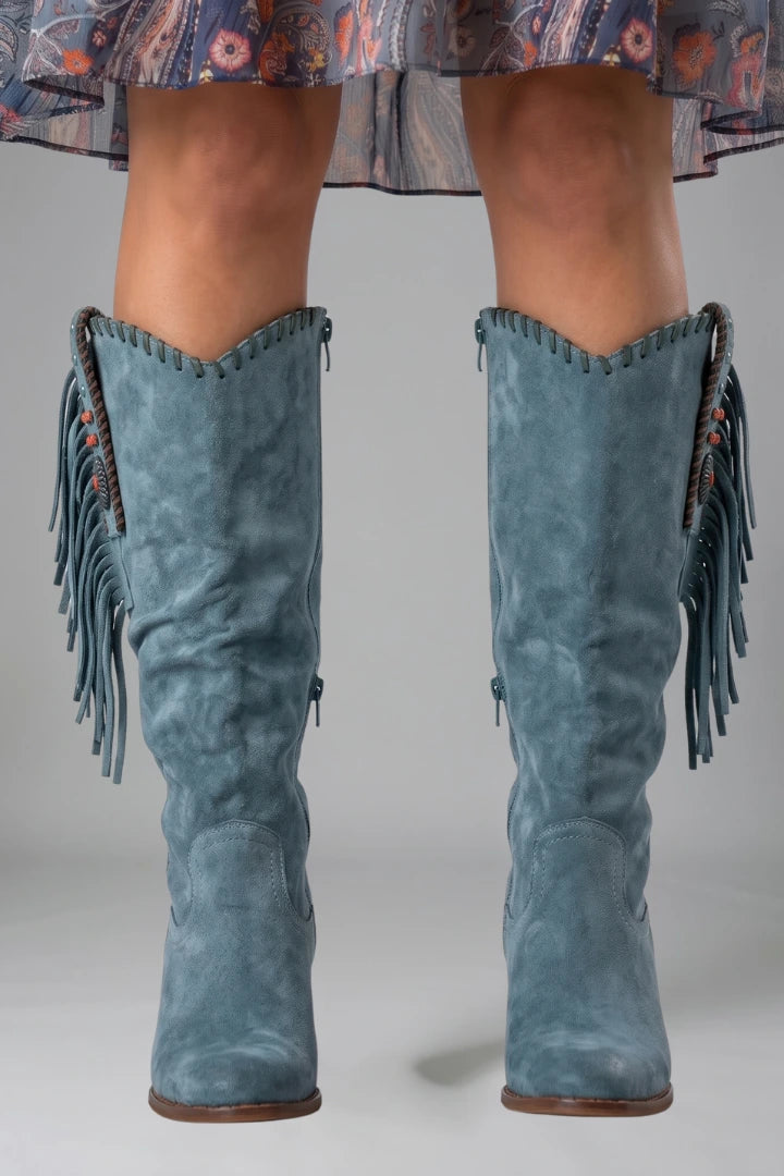 Woman wearing blue orthopedic block heel boots - studio photo
